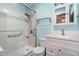 A bathroom featuring a white vanity, toilet, and walk-in shower with grab bars at 6516 Hearthstone Dr # 6516, Raleigh, NC 27615