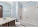 A bathroom featuring a brown vanity, toilet, and tub shower at 6516 Hearthstone Dr # 6516, Raleigh, NC 27615