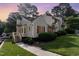 Charming townhome featuring red shutters and lush landscaping in a well-maintained community at 6516 Hearthstone Dr # 6516, Raleigh, NC 27615