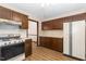 A full kitchen featuring wooden cabinets, laminate countertops, and a white refrigerator at 6516 Hearthstone Dr # 6516, Raleigh, NC 27615