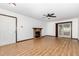 Spacious living room with wood-look floors, a brick fireplace, and a ceiling fan at 6516 Hearthstone Dr # 6516, Raleigh, NC 27615