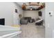 Spacious basement with plush carpeting, gray sectional couch, and custom ceiling design at 707 Lakewood Dr, Siler City, NC 27344