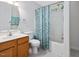 Bathroom with a shower/tub combo and a light blue floral shower curtain at 707 Lakewood Dr, Siler City, NC 27344
