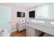 Cozy bedroom with pink walls, modern TV, and a unique bunk bed design at 707 Lakewood Dr, Siler City, NC 27344