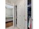 View of a closet and partial view of a bedroom with hardwood floors at 707 Lakewood Dr, Siler City, NC 27344