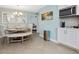 Dining room with a round table, upholstered seating, and access to the kitchen area at 707 Lakewood Dr, Siler City, NC 27344