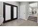 Inviting entryway boasts tile flooring, carpeted stairs and stylish doors to the exterior at 707 Lakewood Dr, Siler City, NC 27344