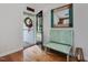 Welcoming foyer with a comfortable bench, decorative mirror, and views to the outside at 707 Lakewood Dr, Siler City, NC 27344