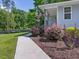 Close up of the front porch with brick base, railing and American flag at 707 Lakewood Dr, Siler City, NC 27344