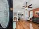Inviting living room with hardwood floors, ceiling fan, and a view into the dining area at 707 Lakewood Dr, Siler City, NC 27344