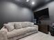 Recreation room features comfortable seating, flat screen tv, and golf simulator at 707 Lakewood Dr, Siler City, NC 27344