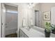 Well-lit bathroom with a single vanity, framed mirror, and a shower and tub combination at 817 Ember Dr, Durham, NC 27703