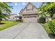 Charming two-story home with a two car garage and a well maintained lawn at 817 Ember Dr, Durham, NC 27703
