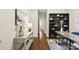 Home office with hardwood floors, built-in shelving and a desk at 817 Ember Dr, Durham, NC 27703