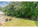 Spacious backyard with patio area, lawn, and privacy fencing at 8512 Erinsbrook Dr, Raleigh, NC 27617