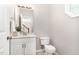 Bathroom with white vanity, mirror, and neutral walls at 8512 Erinsbrook Dr, Raleigh, NC 27617