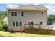 Back exterior view showing wooden deck, patio, and backyard at 8512 Erinsbrook Dr, Raleigh, NC 27617