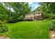 Expansive backyard featuring lush green grass and a beautiful deck, perfect for outdoor gatherings at 8608 Valley Brook Dr, Raleigh, NC 27613
