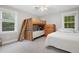 Bedroom with bunk beds and a full bed, offering a comfortable and playful space at 8608 Valley Brook Dr, Raleigh, NC 27613