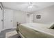 Cozy bedroom with a large bed, soft rug, ceiling fan and ample closet space at 8608 Valley Brook Dr, Raleigh, NC 27613