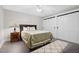 Spacious bedroom features a large bed, a ceiling fan and sliding-door closets at 8608 Valley Brook Dr, Raleigh, NC 27613