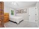 Bedroom featuring a single bed, wood dresser, cartoon decor and a neutral color scheme at 8608 Valley Brook Dr, Raleigh, NC 27613