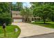 Attractive home featuring a long driveway, a two-car garage, and an inviting front porch at 8608 Valley Brook Dr, Raleigh, NC 27613