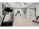 Home gym with treadmill, weights, and adjacent office space, offering convenience and functionality at 8608 Valley Brook Dr, Raleigh, NC 27613