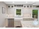 Charming kitchen with a farmhouse sink, granite countertops, and stainless steel appliances at 8608 Valley Brook Dr, Raleigh, NC 27613