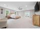 Spacious main bedroom with large windows, ceiling fan, and ample natural light at 8608 Valley Brook Dr, Raleigh, NC 27613
