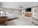 Bright main bedroom with a ceiling fan and a swing chair, creating a cozy retreat at 8608 Valley Brook Dr, Raleigh, NC 27613
