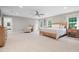 A sunlit main bedroom featuring neutral tones, plush carpet, and inviting furnishings at 8608 Valley Brook Dr, Raleigh, NC 27613