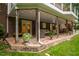 Covered back patio offers outdoor living and dining areas and access to the landscaped yard at 8608 Valley Brook Dr, Raleigh, NC 27613