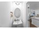 Stylish powder room featuring a pedestal sink and modern fixtures at 8732 Wardle Ct, Wake Forest, NC 27587