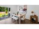 Bright dining room adjacent to patio offers ample space for entertaining at 8732 Wardle Ct, Wake Forest, NC 27587