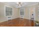 Bedroom with hardwood floors and natural light from the windows at 938 Hargrove St, Henderson, NC 27536