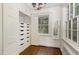 Well-organized closet with built-in drawers, overhead storage, and mirror at 938 Hargrove St, Henderson, NC 27536