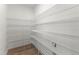 Walk-in pantry with metal shelving providing ample storage space for all your pantry items at 94 Lipford Ct # 40, Selma, NC 27576