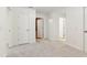 Neutral bedroom featuring plush carpeting and multiple doorways for seamless flow at 100 Lexington Ave, Zebulon, NC 27597