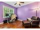 Office space featuring hardwood floors, natural light, and comfortable seating at 100 Lexington Ave, Zebulon, NC 27597