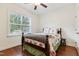 Comfortable bedroom with natural light and wood floors creates a relaxing retreat at 100 Lexington Ave, Zebulon, NC 27597