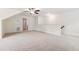 Carpeted bonus room features a ceiling fan, recessed lighting, and neutral walls at 100 Lexington Ave, Zebulon, NC 27597
