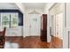 Elegant foyer with hardwood floors, wainscoting, and a view of the front door at 100 Lexington Ave, Zebulon, NC 27597