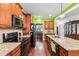 Gourmet kitchen boasts granite countertops, stainless steel appliances, and ample cabinetry for storage at 100 Lexington Ave, Zebulon, NC 27597