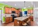 Spacious kitchen island with seating, ample cabinet space, and modern black appliances at 100 Lexington Ave, Zebulon, NC 27597