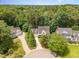 Aerial view of home nestled amongst lush greenery and a beautiful suburban neighborhood at 104 Odessa Cir, Cary, NC 27513
