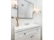 Bathroom featuring a vanity, chrome fixtures, an elegant mirror, and decorative accents at 104 Odessa Cir, Cary, NC 27513