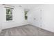 Bedroom featuring neutral carpet and two windows bringing in lots of natural light at 104 Odessa Cir, Cary, NC 27513