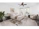 Spacious main bedroom featuring a ceiling fan and abundant natural light from the large windows at 104 Odessa Cir, Cary, NC 27513