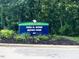 Park sign for Fred G. Bond Metro Park in Cary, welcoming visitors with lush greenery around it at 104 Odessa Cir, Cary, NC 27513